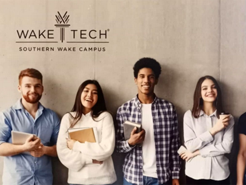 Wake Tech students in front of a Southern Wake Campus sign