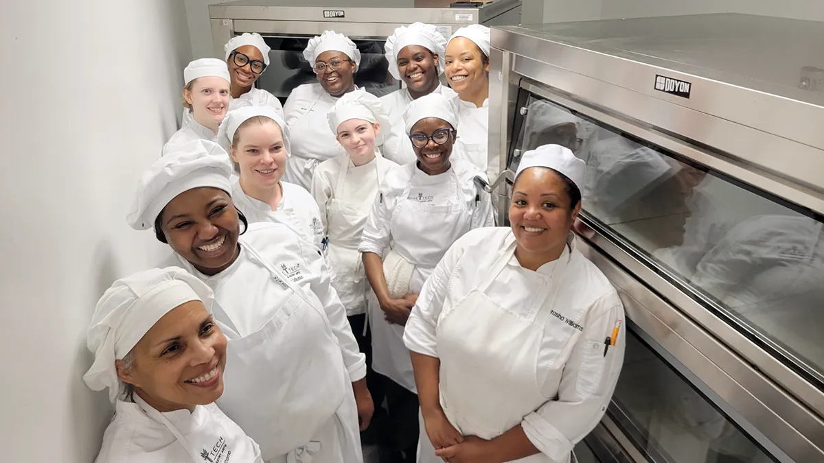 Wake Tech Culinary Arts students pose with donated ovens.