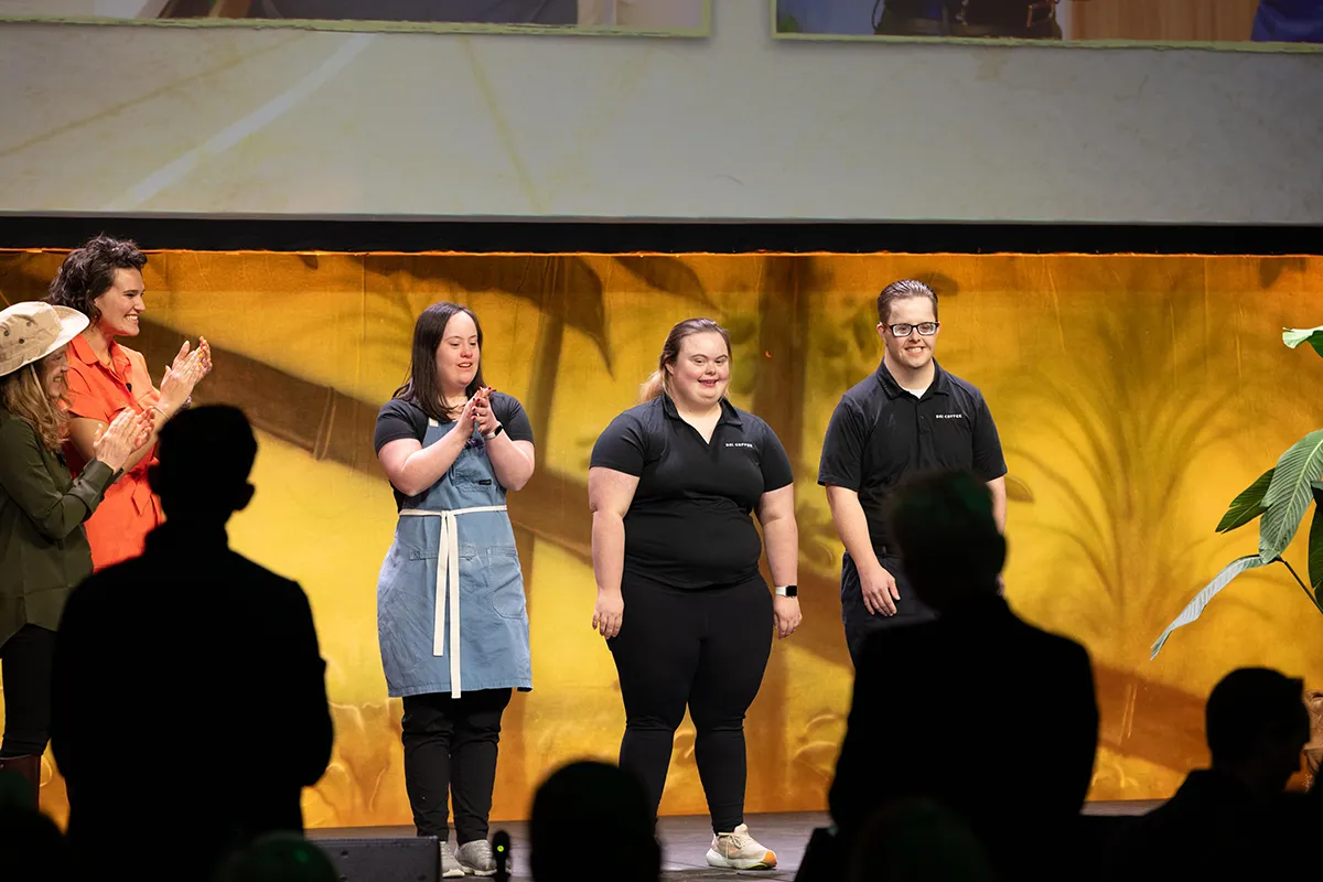 Sophie Hening, center, Wake Tech Pathfinders graduate and 321 Coffee employee, was honored at the 2025 Wake Tech IGNITE event.