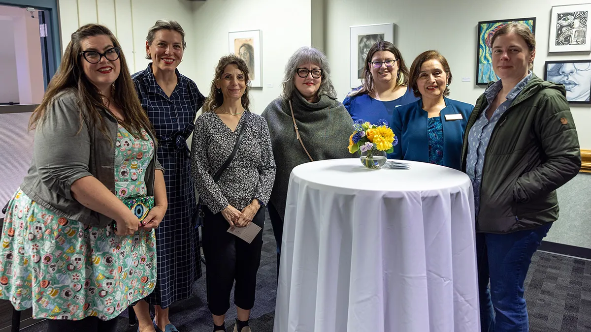 Wake Tech Fine Arts faculty attend the opening-night reception for a juried art exhibition.