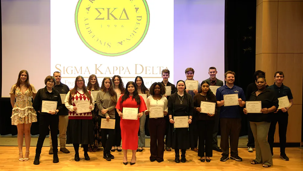 New members of Wake Tech's Sigma Kappa Delta chapter pose for a photo following their induction ceremony.