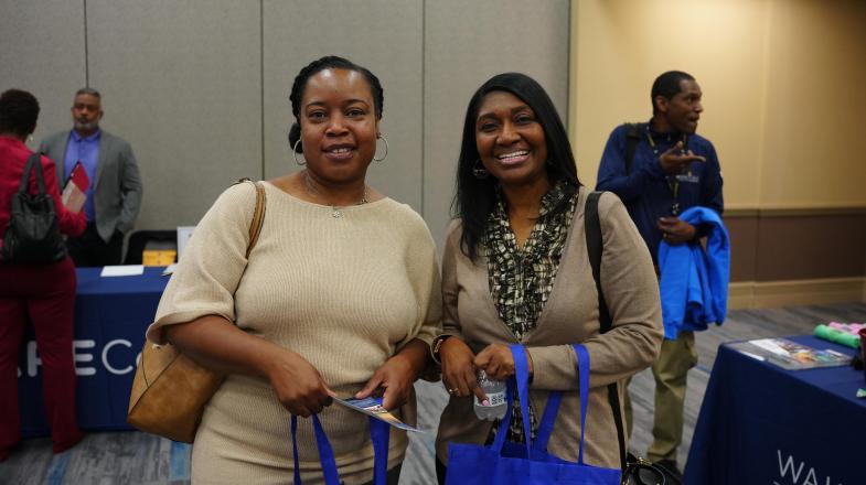 Two women attend a 2023 Wake Tech job fair.