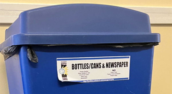 Blue recycling bin on campus