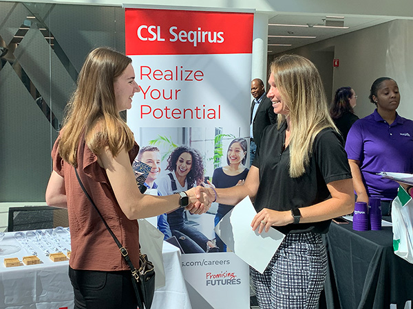 A Wake Tech student meets with a potential employer during a Biotechnology Career Fair.