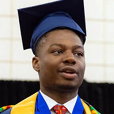 image of Wake tech graduate Juby Agwu wearing his cap & gown.