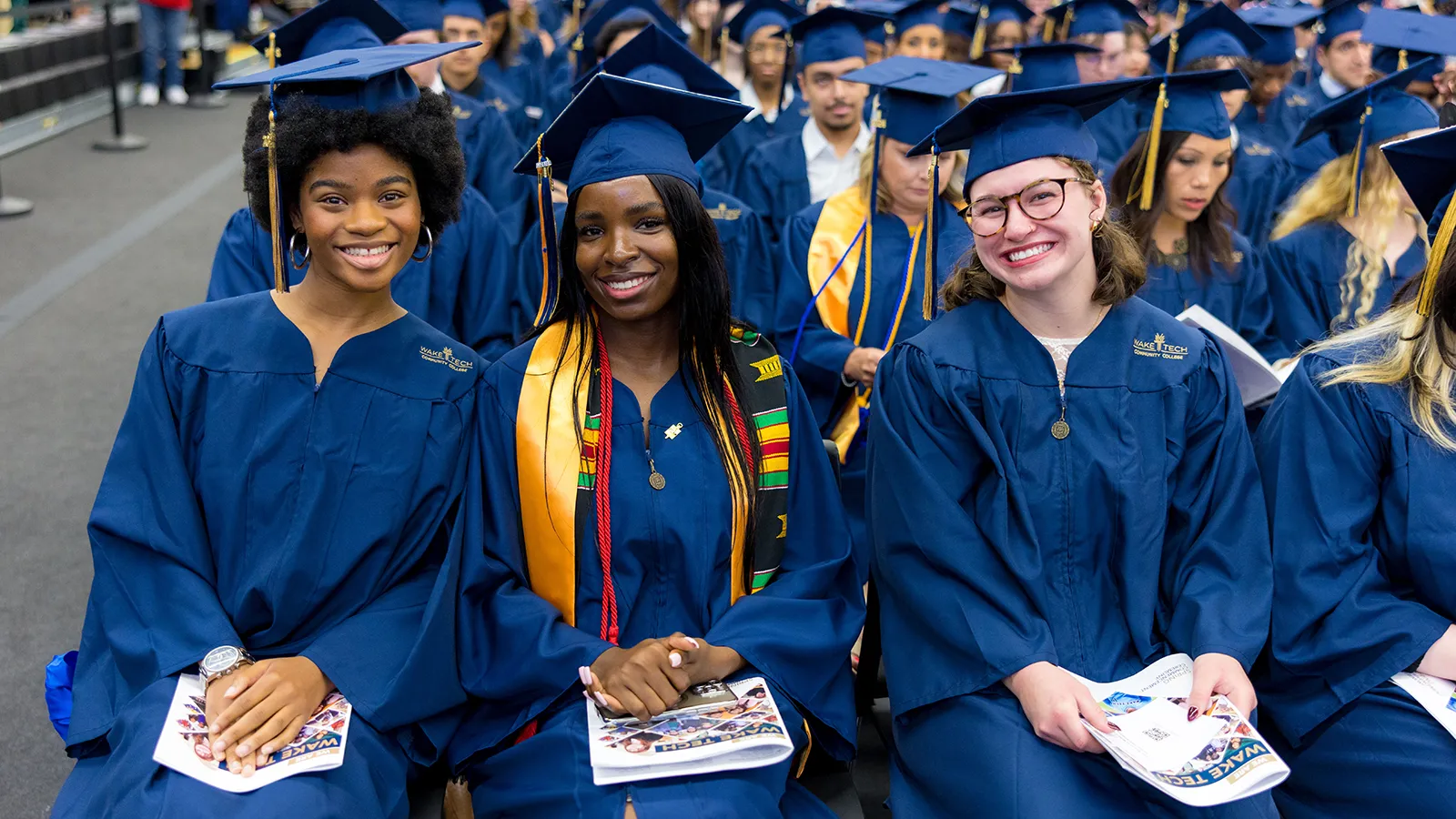 Wake Tech graduates celebrate at commencement.