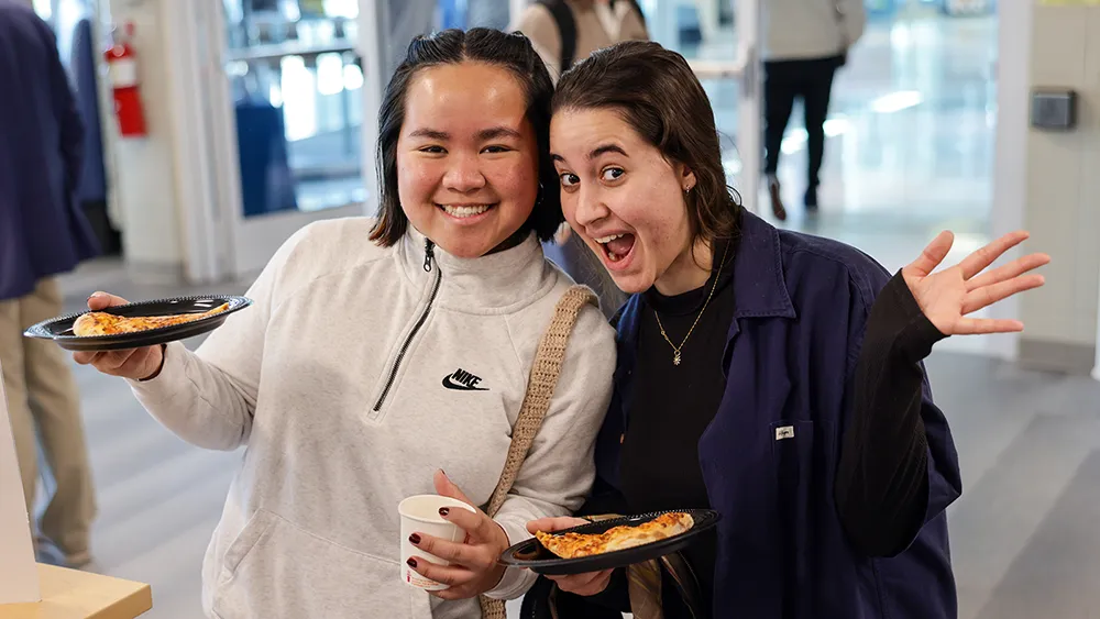 Students enjoy pizza at a Wake Tech event.