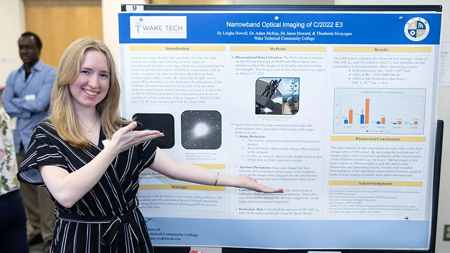 A student in the STEM Academic Research and Training program shows off the results of her scientific research.