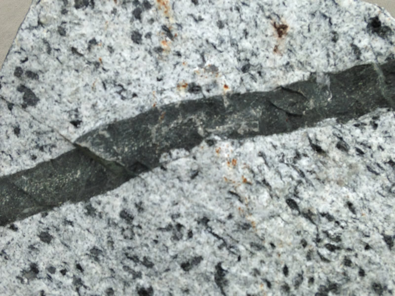 Figure 5: The surface of the monzonite with a basalt dike running through it.