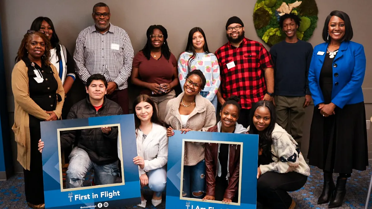 A group of first-generation college students pose for a photo.
