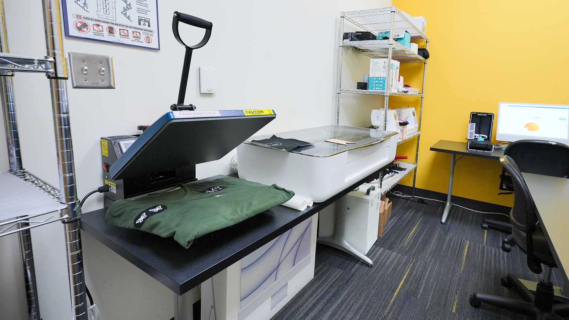 Heat press and other equipment in Scott Northern Wake Campus library makerspace