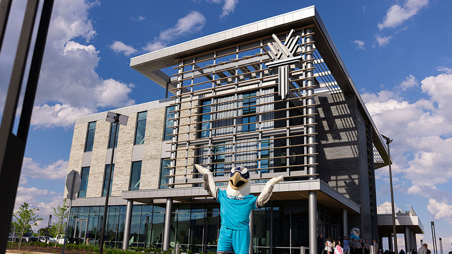 Wake Tech mascot Talon celebrates the opening of Wake Tech East