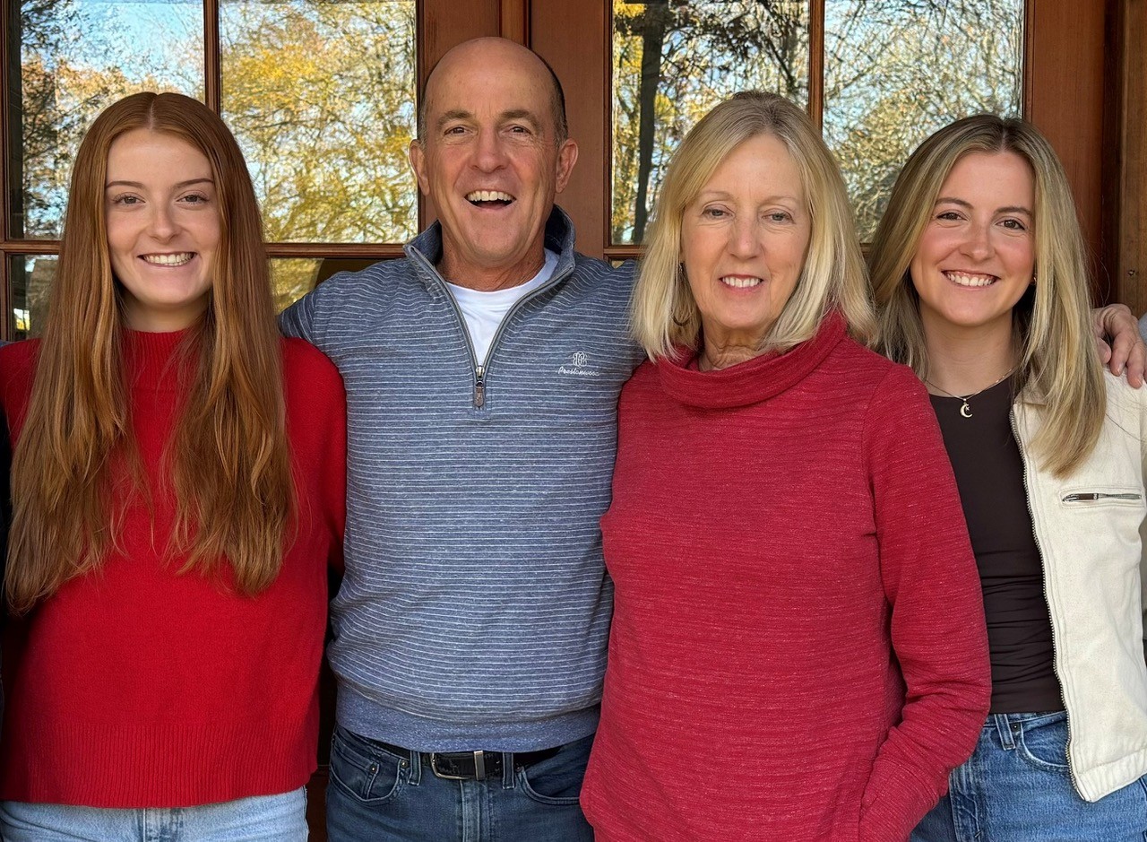 Rick and Katherine Peele pose for a photo with their two daughters.