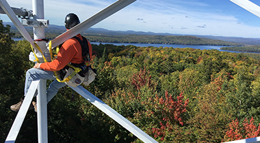 Worker on telecommunications tower