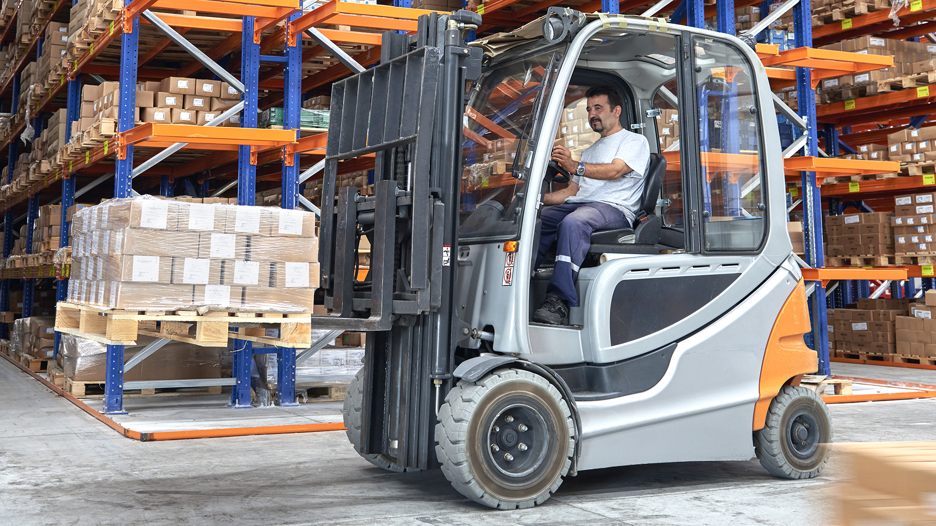 Forklift operator in warehouse