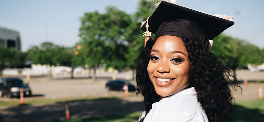 A smiling graduate