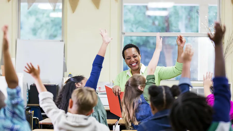 A substitute teacher in an elementary school classroom