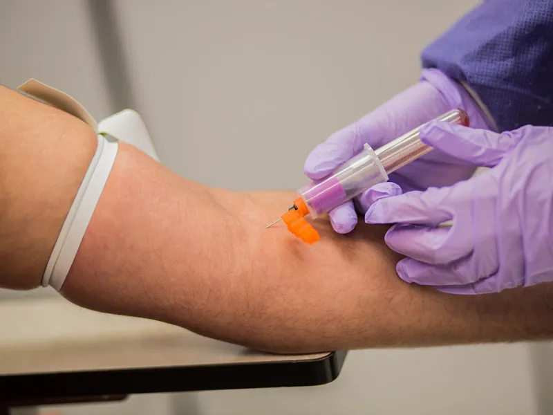 Phlebotomist taking a blood sample