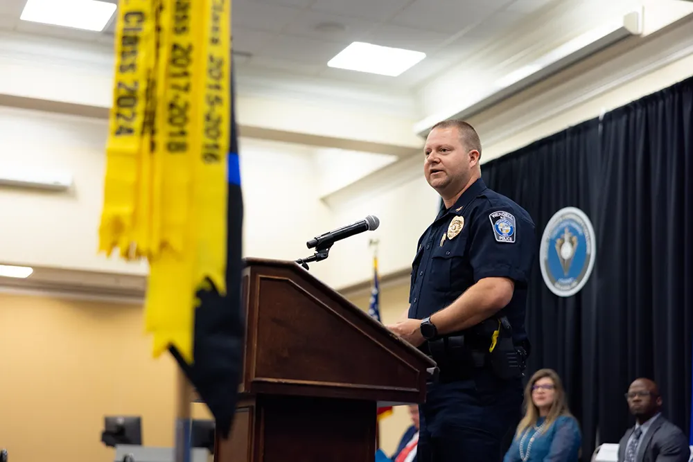 Wendell Police Chief John Slaughter speaks to Basic Law Enforcement Training Academy graduates.