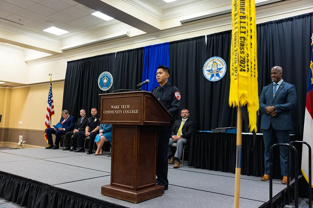 Wake Tech Basic Law Enforcement Training Academy graduate Charles Melvin Ong speaks to his classmates.