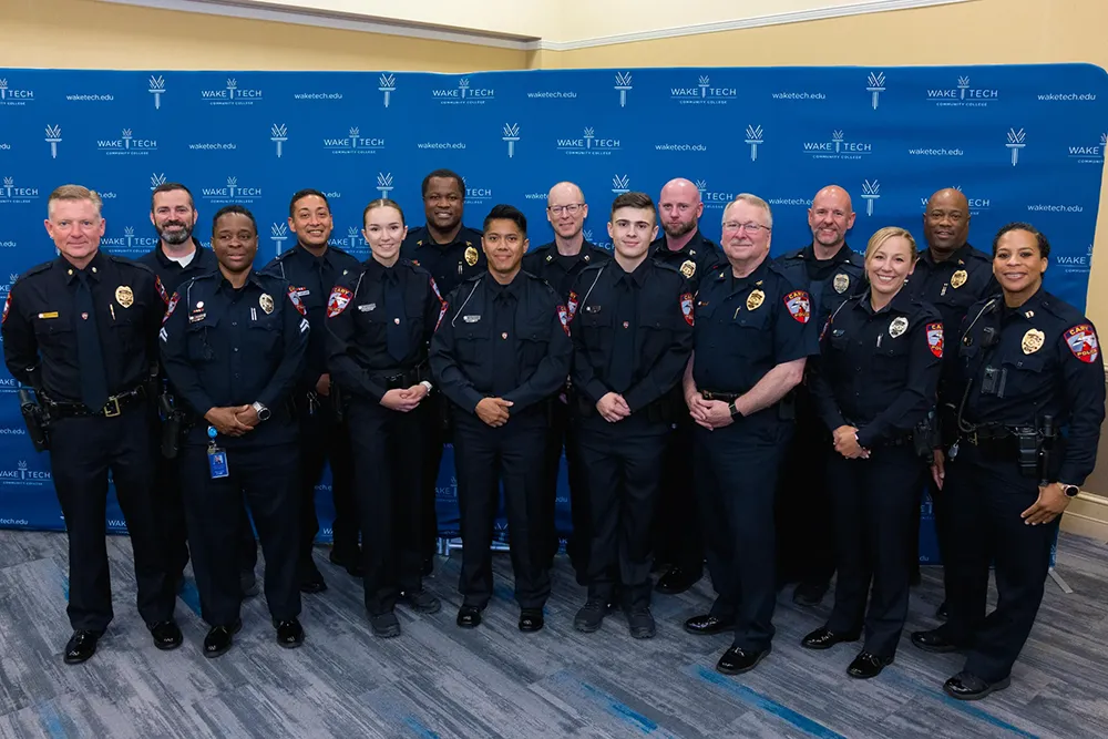 Members of the latest class to graduate from Wake Tech's Basic Law Enforcement Training Academy pose for a photo.