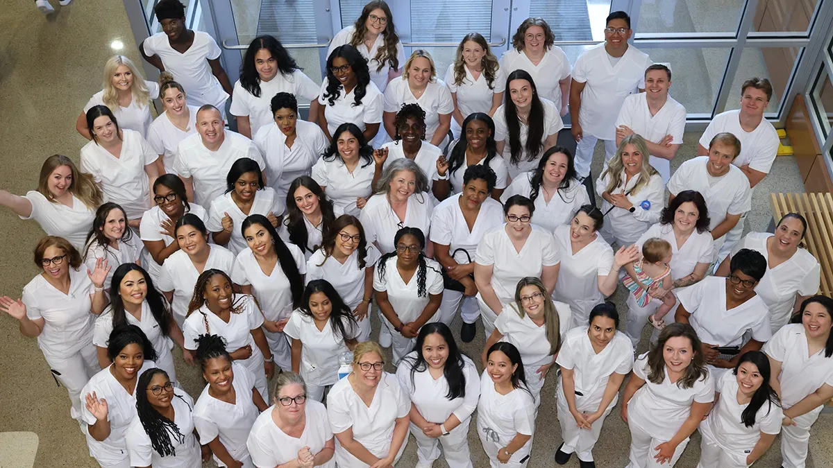 Nursing School graduates pose for a photo after their pinning ceremony.