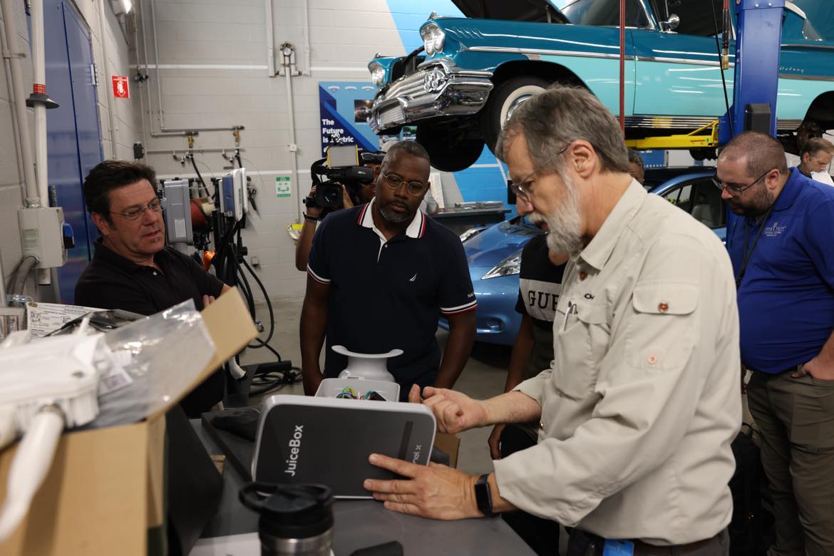 Members of Wake Tech's Electric Vehicle Supply Equipment Field Technician Certification program demonstrate what they've learned.