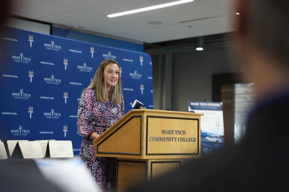 Jessica Englert, Gov. Roy Cooper's policy director, speaks about the need for skilled EV charging station technicians.