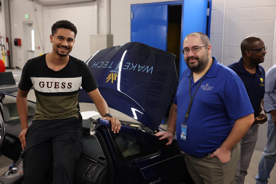 Members of Wake Tech's Electric Vehicle Supply Equipment Field Technician Certification program pose for a photo.