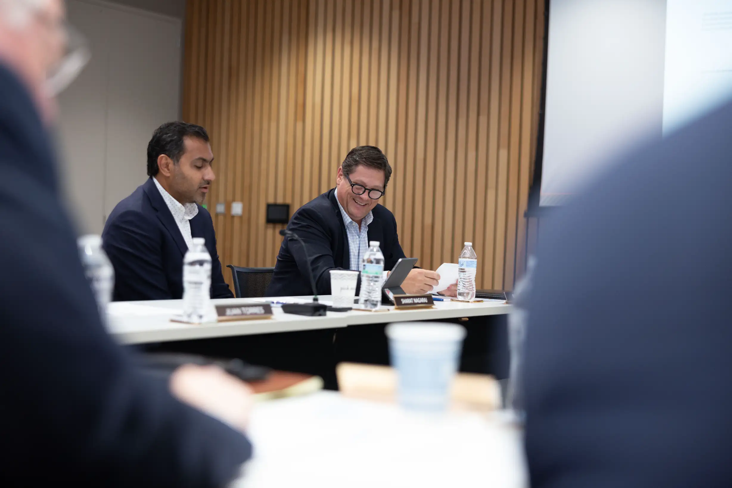  Sharat Nagaraj and "Buzz" Crosby attend Wake Tech Board of Trustees meeting.