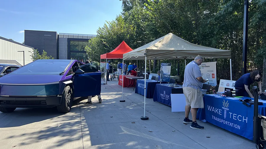 Electric vehicles are celebrated during a car show at the Hendrick Center for Automotive Excellence on Scott Northern Wake Campus.