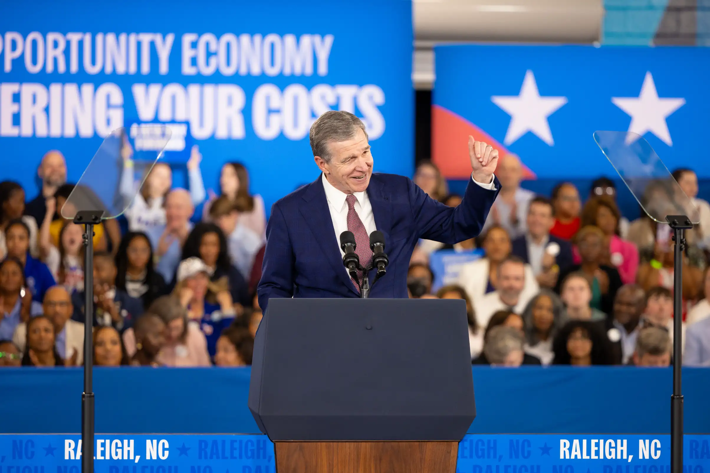 Gov. Roy Cooper speaks during Vice President Kamala Harris' visit to Wake Tech.