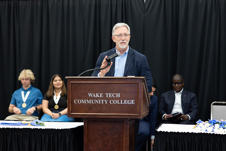 Wake Tech President Dr. Scott Ralls speaks at the Phi Theta Kappa induction ceremony.