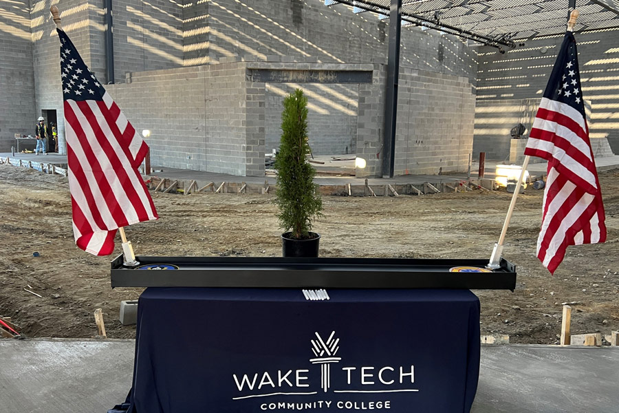 College Holds Topping-Out Ceremony for First Building at Future Campus