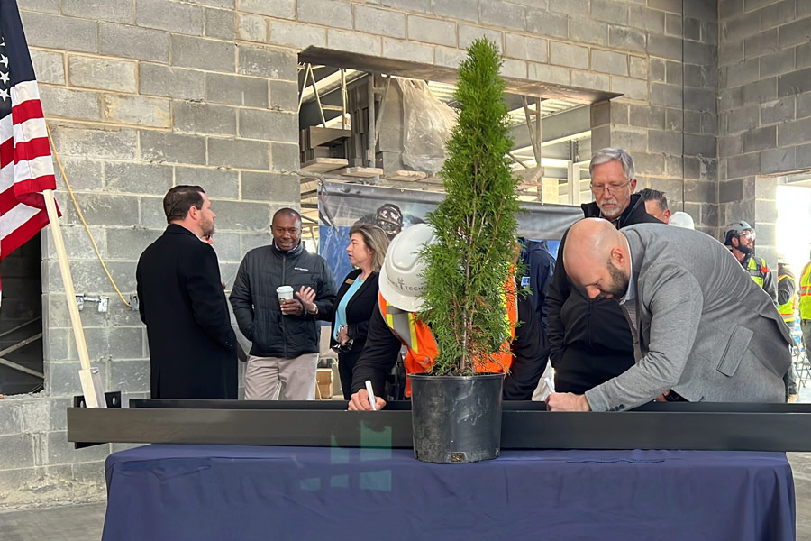 College Holds Topping-Out Ceremony for First Building at Future Campus