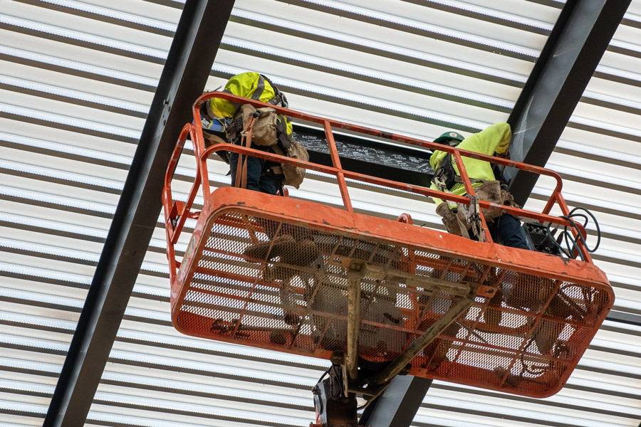 College Holds Topping-Out Ceremony for First Building at Future Campus