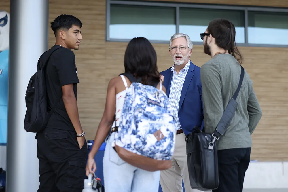 Wake Tech President Dr. Scott Ralls greets students on the first day of the 2024-25 academic year.