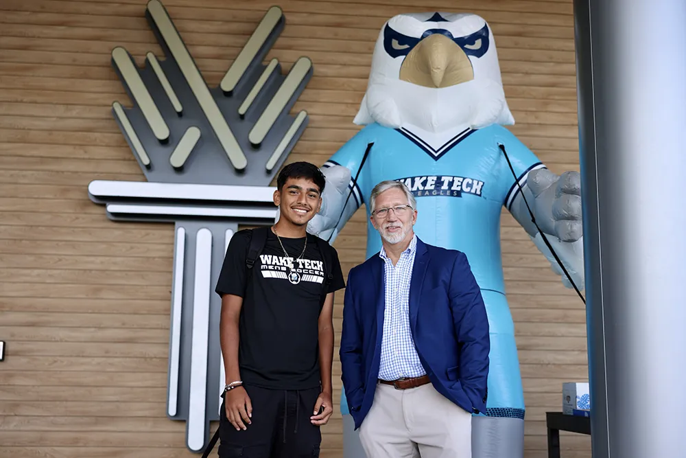 Wake Tech President Dr. Scott Ralls greets a student on the first day of the 2024-25 academic year.