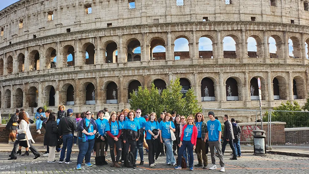 Wake Tech students pose in front of the Coliseum during a 2024 Study Abroad trip to Rome.