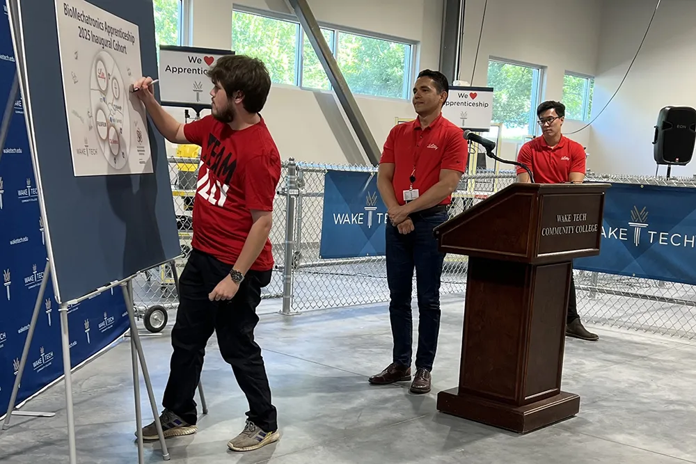 Students demonstrate their knowledge during a ceremony marking the launch of Wake Tech's biomechantronics apprenticeship program.