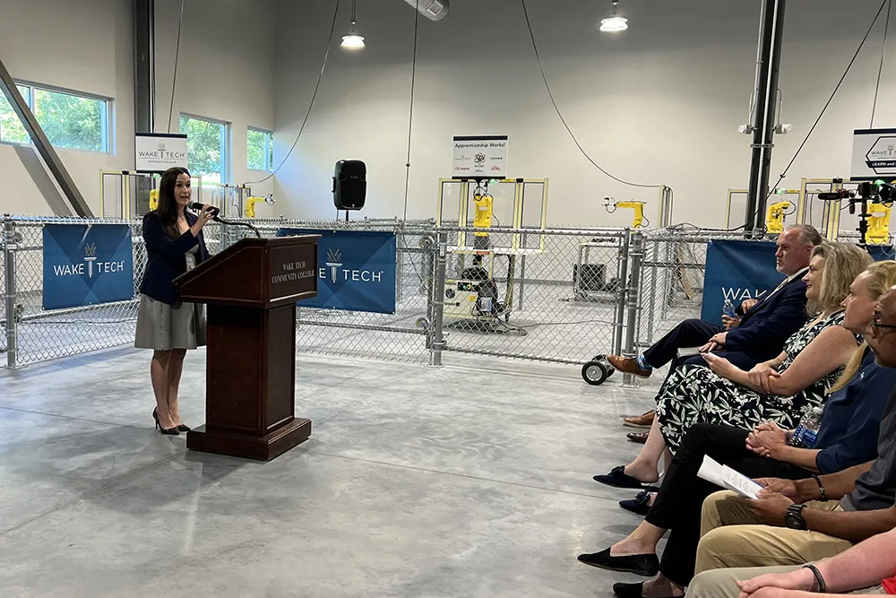 North Carolina Biotechnology Center Vice President Dr. Laura Rowley speaks during a ceremony marking the launch of Wake Tech's biomechantronics apprenticeship program.