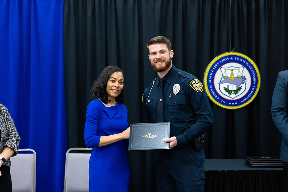Anthony Caison, Wake Tech VP of Workforce Development, speaks during the Wake Tech Basic Law Enforcement Training Academy graduation on May 20, 2025. (Court Johnson/Wake Tech)