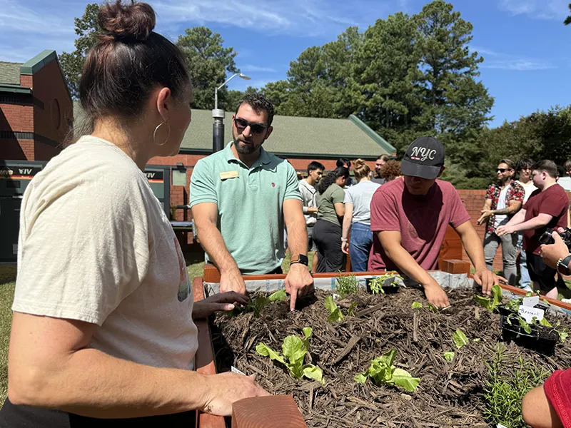 Wake Tech students check out the vegetable garden on Southern Wake Campus.