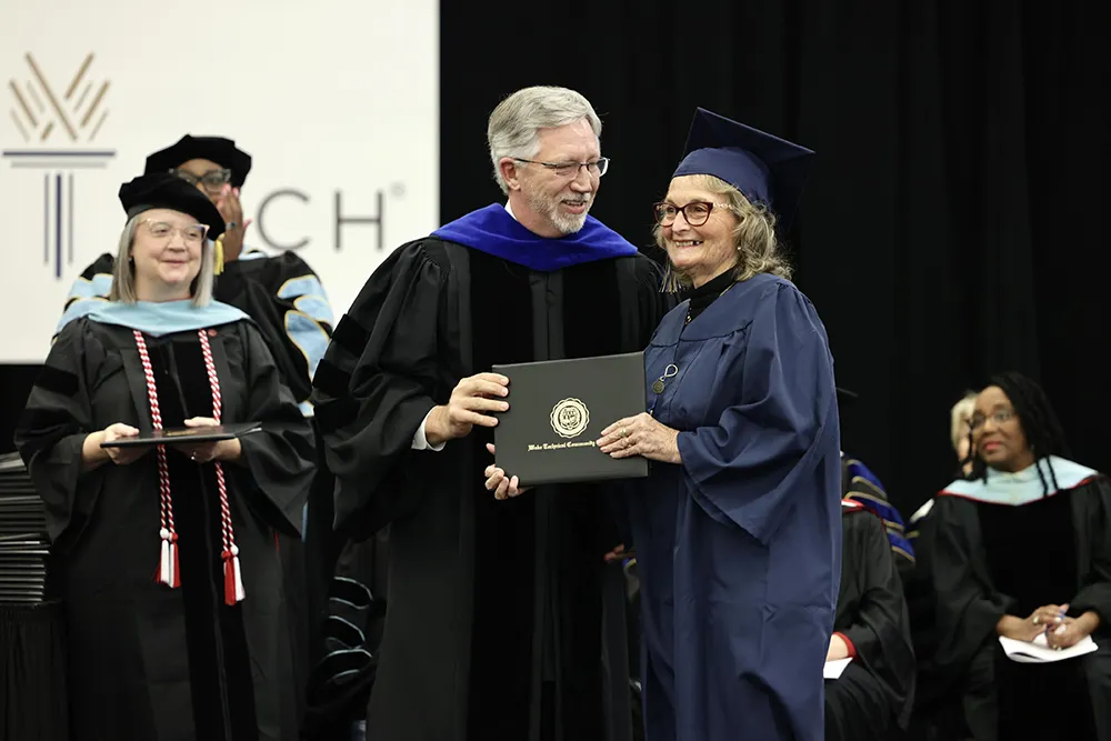 Wake Tech President Dr. Scott Ralls and graduate Eva Gentile