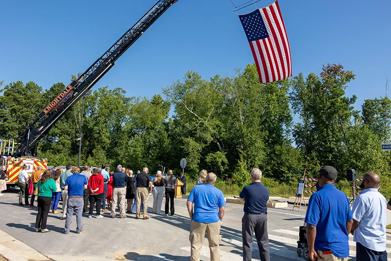Area firefighters and Wake Tech officials applaud the groundbreaking ceremony for the Advanced Fire and Rescue Training Complex at Wake Tech East.