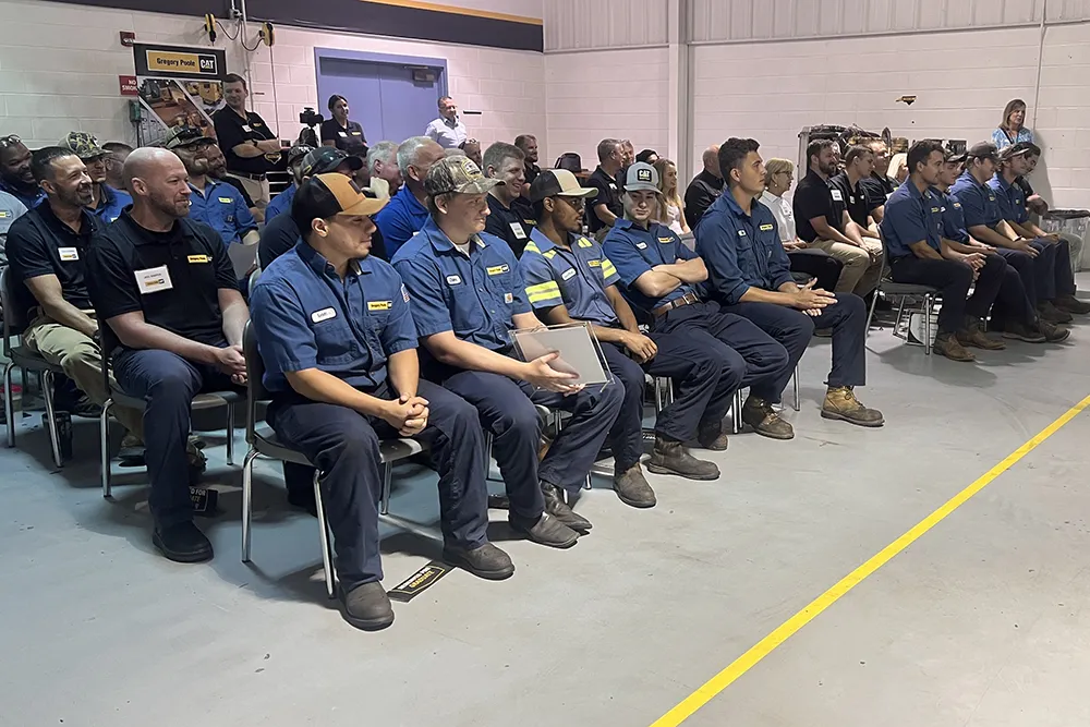 Gregory Poole apprentices gather with family and friends for a graduation ceremony.
