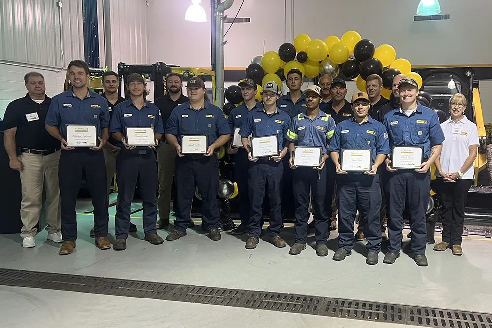 Wake Tech students pose with instructors after earning Journeyworker Certificates from the college's apprenticeship program with Gregory Poole Equipment Co.