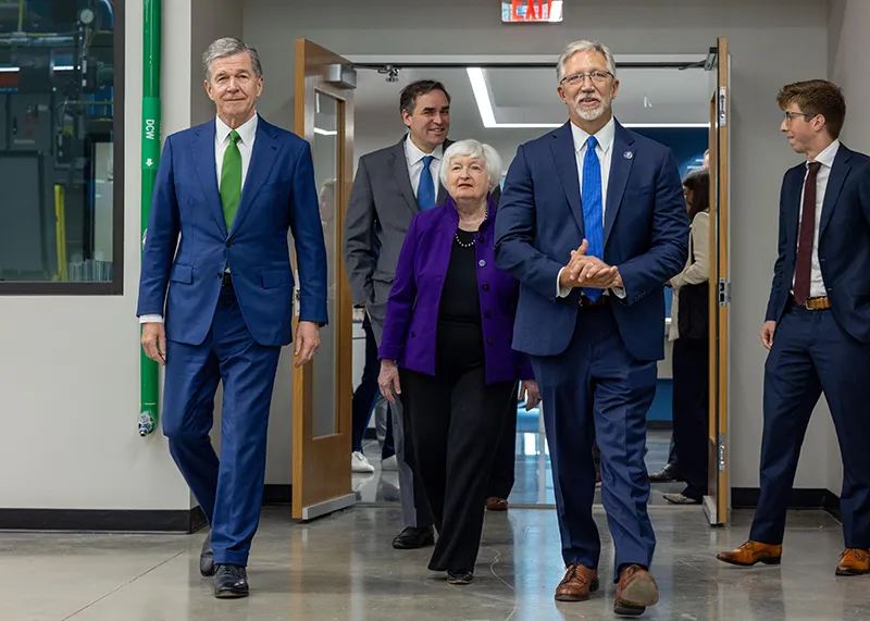 Wake Tech President Dr. Scott Ralls, right, and North Carolina Gov. Roy Cooper, left, accompany U.S. Treasury Secretary Janet Yellen during a tour of Wake Tech East facilities.