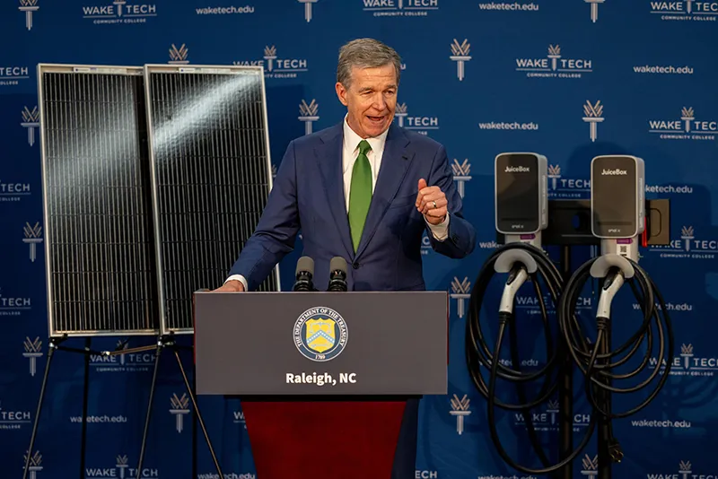 North Carolina Gov. Roy Cooper addresses dignitaries during U.S. Treasury Secretary Janet Yellen's visit to Wake Tech.