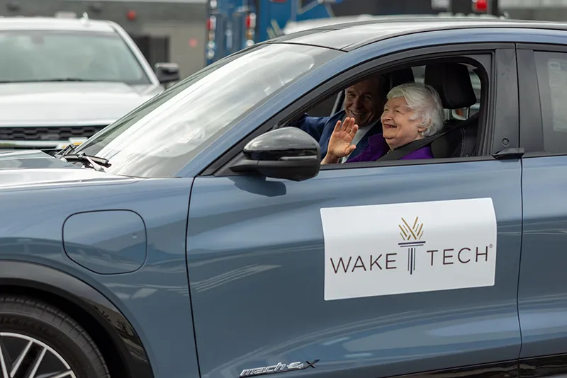U.S. Treasury Secretary Janet Yellen takes North Carolina Gov. Roy Cooper for a ride in an electric vehicle.